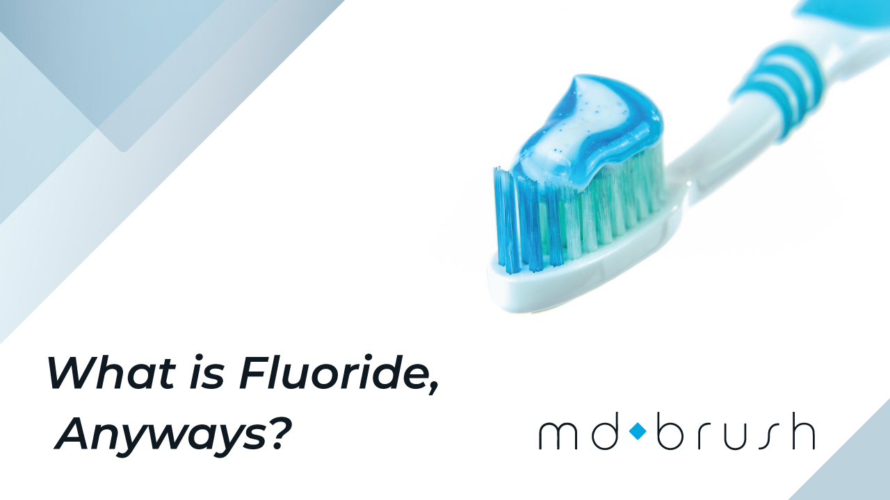 A picture of a toothbrush with fluoride toothpaste and the question 'What is Fluoride, Anyways?'.